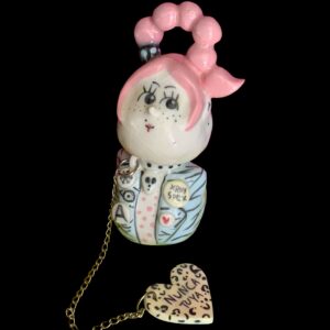 Ceramic girl with heart charm